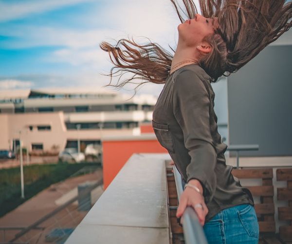 Happy person enjoying clear view and energy outdoors